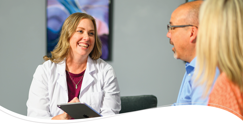 Audiologist talking with patients