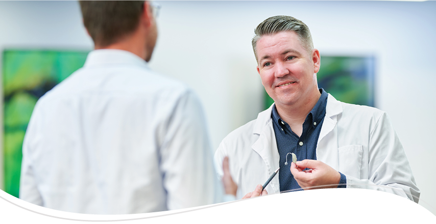 A provider speaks to his teammate