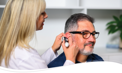 Audiologist working with patient