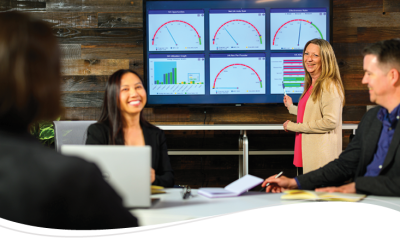 Audigy team members reviewing KPIs and benchmarks