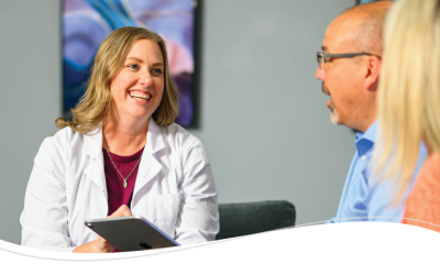 Audiologist talking with patients